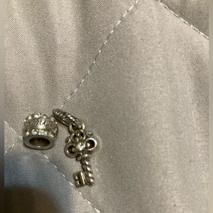 Brighton charms. One is key other says family. Good condition